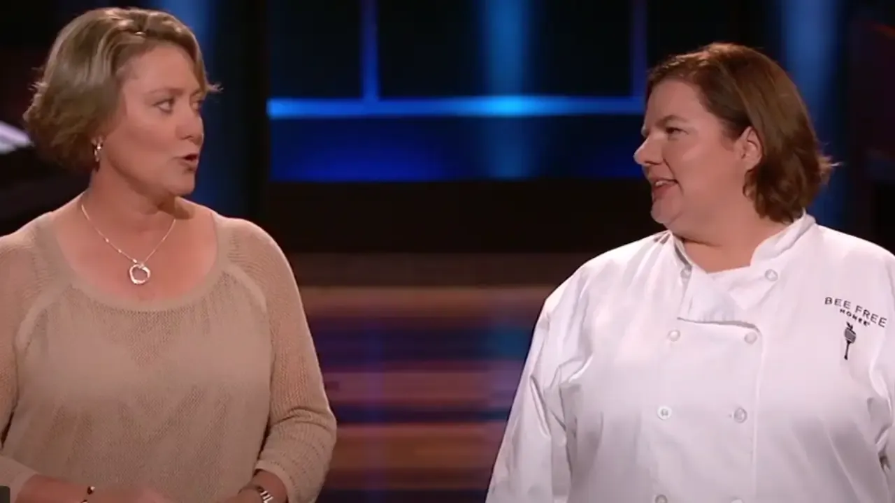 Bee Free Honee founders Katie Sanchez and Melissa Elms standing on the Shark Tank stage, pitching their apple-based honey substitute.