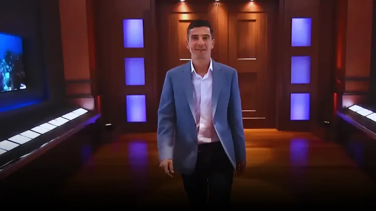 Bruno François walking confidently into the Shark Tank studio in a blue blazer before pitching Cycloramic