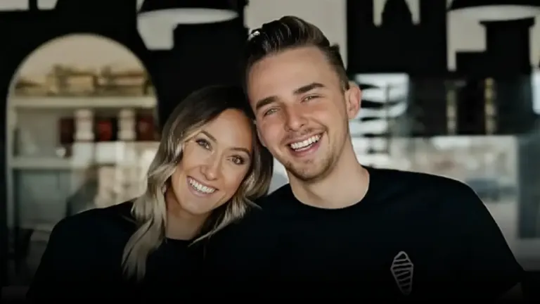 Jeremy and Kaitlyn Carlson smiling together inside a Crispy Cones dessert shop, wearing black branded shirts.