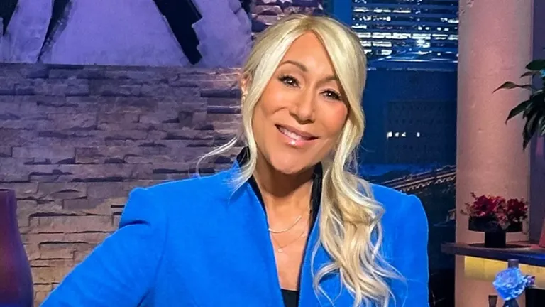 Lori Greiner smiling on the Shark Tank set while sharing her top pitch tips for entrepreneurs