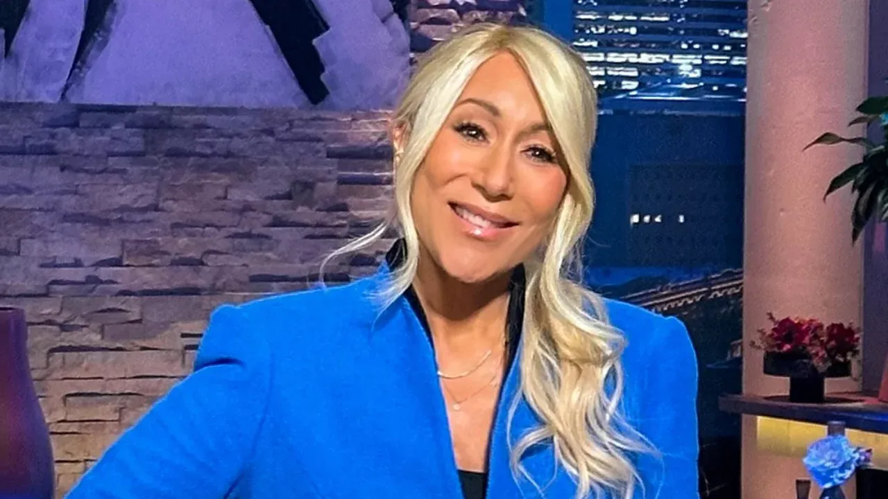Lori Greiner smiling on the Shark Tank set while sharing her top pitch tips for entrepreneurs