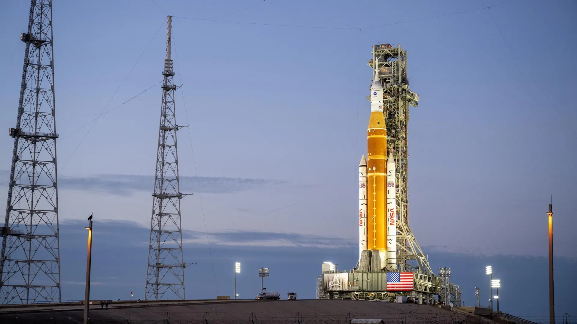 Artemis II SLS rocket and Orion spacecraft illuminated at Launch Pad 39B during nighttime prelaunch preparations at NASA’s Kennedy Space Center.