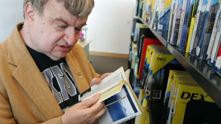 Kim Peek reading a book at the library, showcasing his photographic memory and savant abilities.