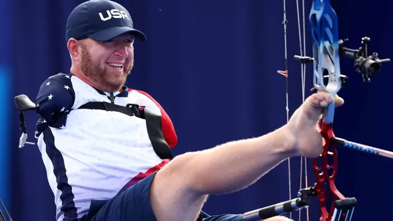 Matt Stutzman, the armless archer, uses his foot to draw a compound bow during his gold medal match at the 2024 Paris Paralympics.