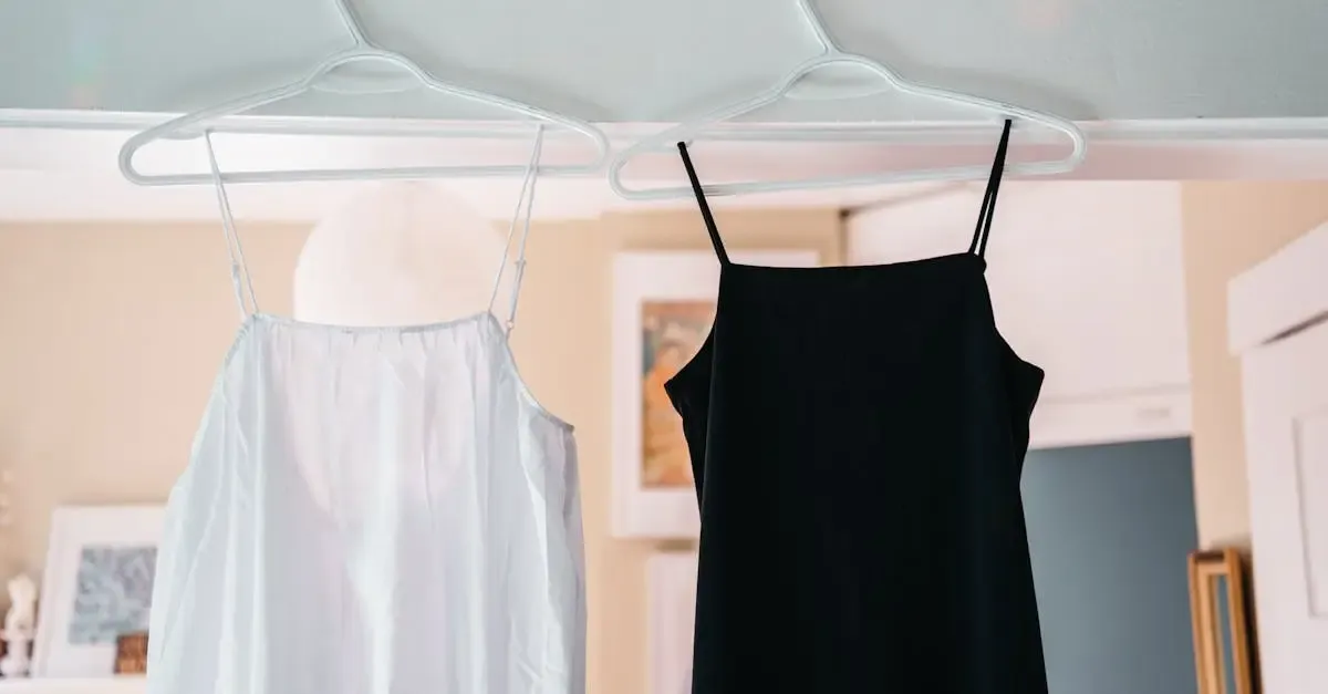 Minimalist display of black and white spaghetti strap dresses hanging indoors.