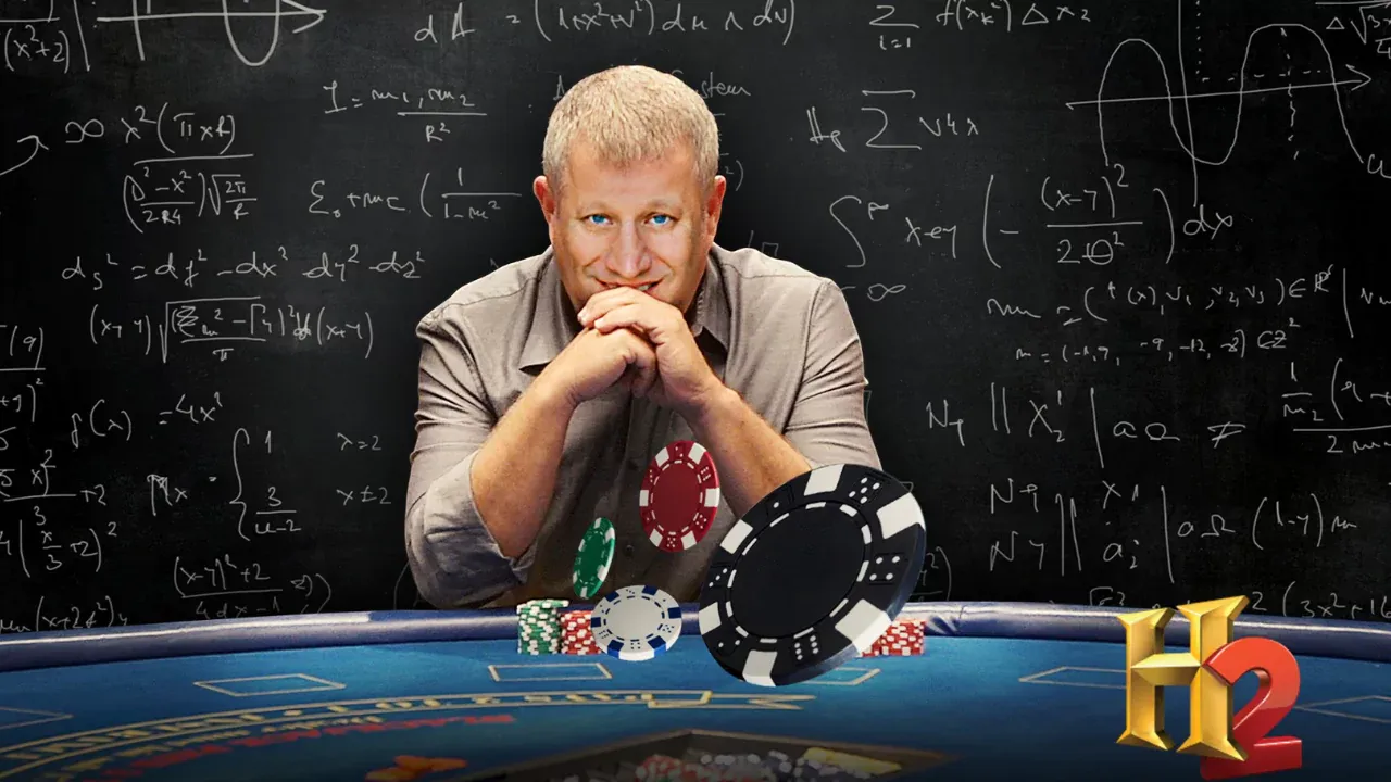 Scott Flansburg, the fastest human calculator, sitting at a poker table with math equations on a chalkboard behind him