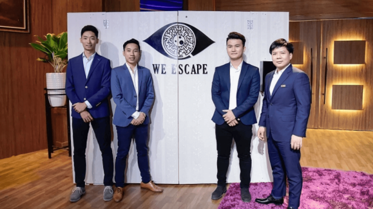 Founders of We Escape Vietnam posing with Shark Tank investor Shark Thuy on the set of Shark Tank Vietnam