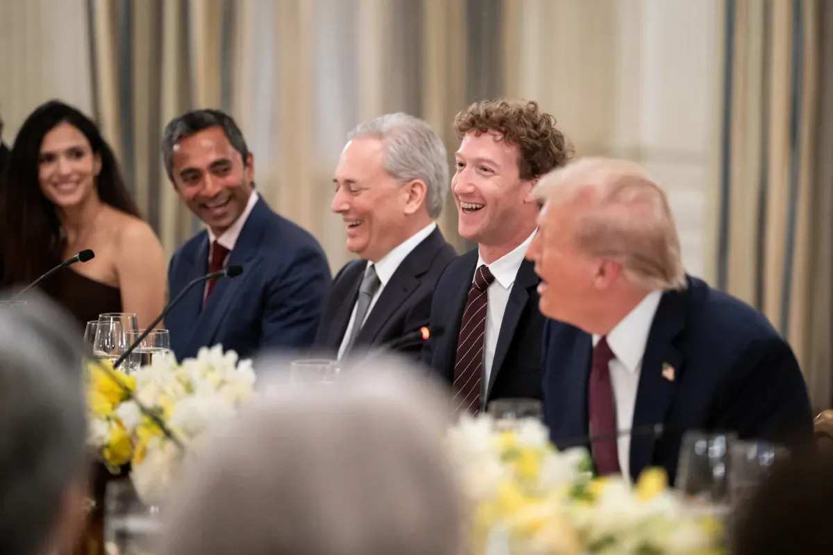 "Mark Zuckerberg and Donald Trump share a laugh with executives at the White House AI dinner.