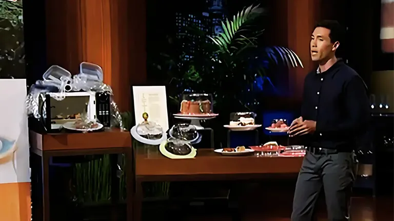 Michael Tseng presenting PlateTopper on Shark Tank, with multiple food storage displays and a microwave setup.