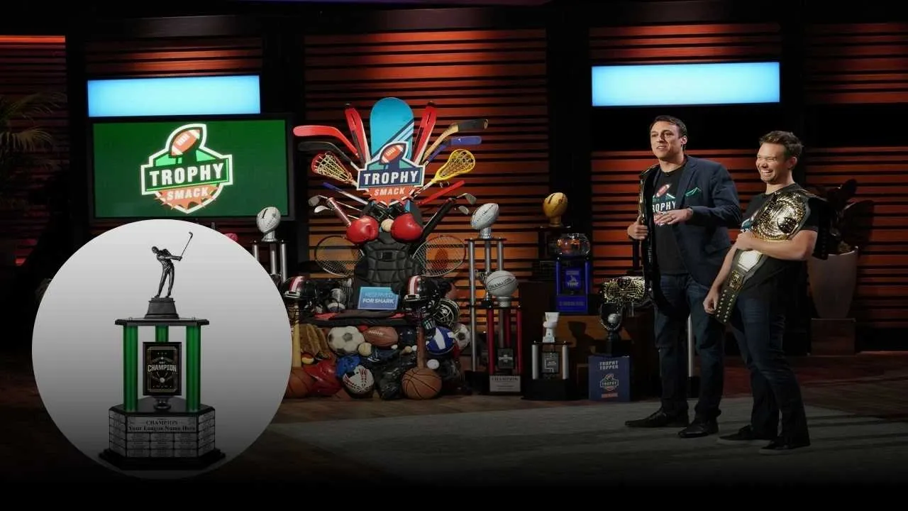 Trophy Smack founders pitching custom fantasy sports trophies on Shark Tank with championship belts and sports-themed props