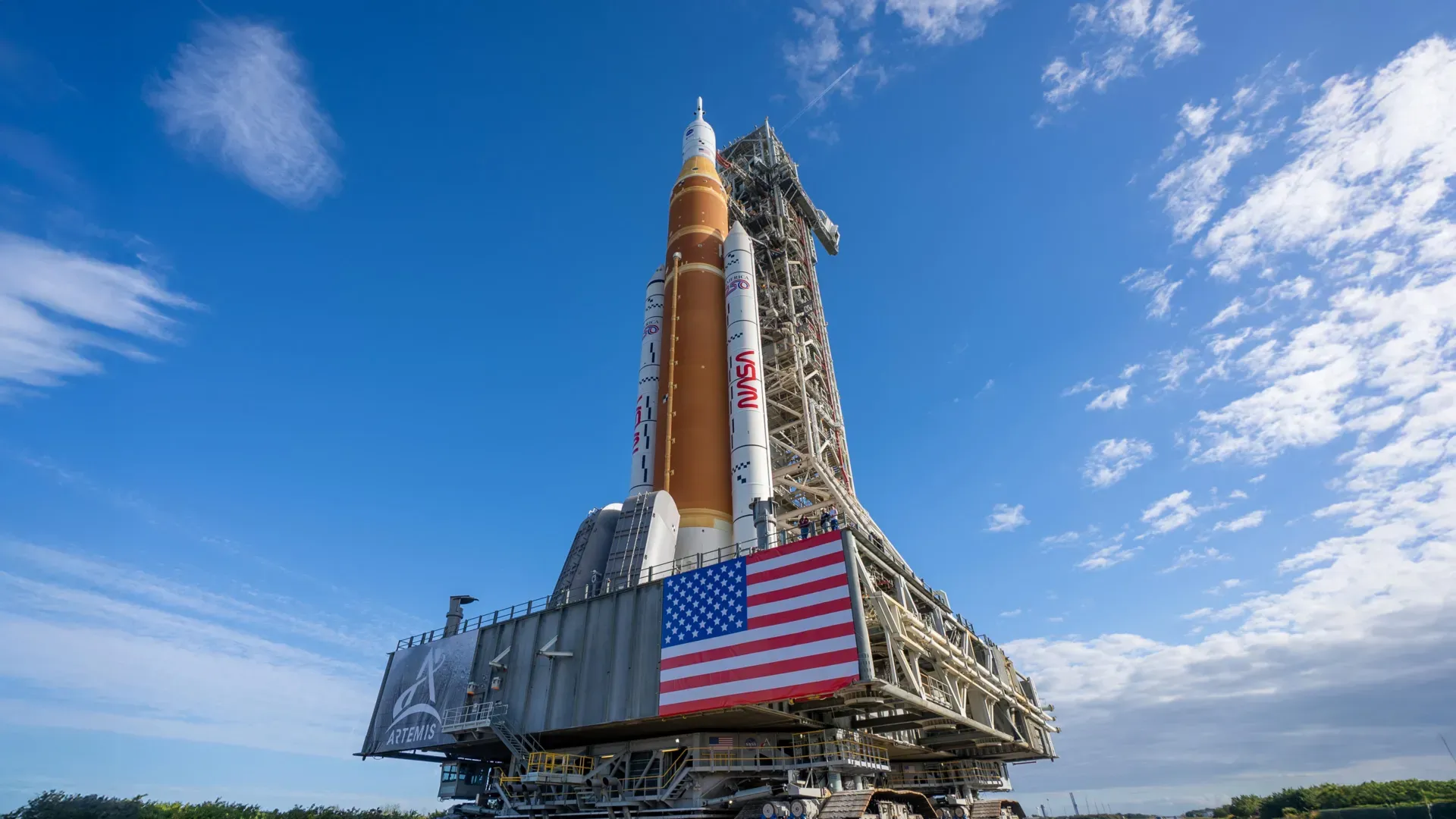NASA’s Crawler-Transporter moving the SLS rocket and Orion spacecraft from the Vehicle Assembly Building to Launch Pad 39B for Artemis II.