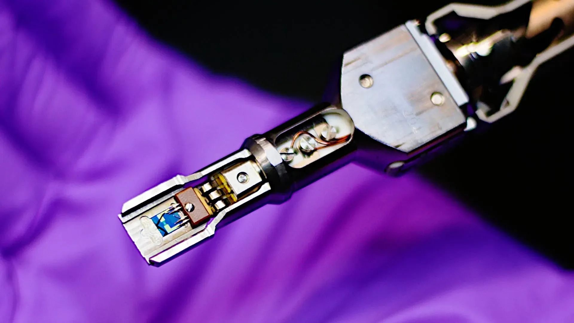 Protochips Fusion heating stage and chip inside the Nion electrical module, allowing researchers to run precise high-temperature experiments in the microscope’s vacuum environment. Credit: Jani Kotakoski