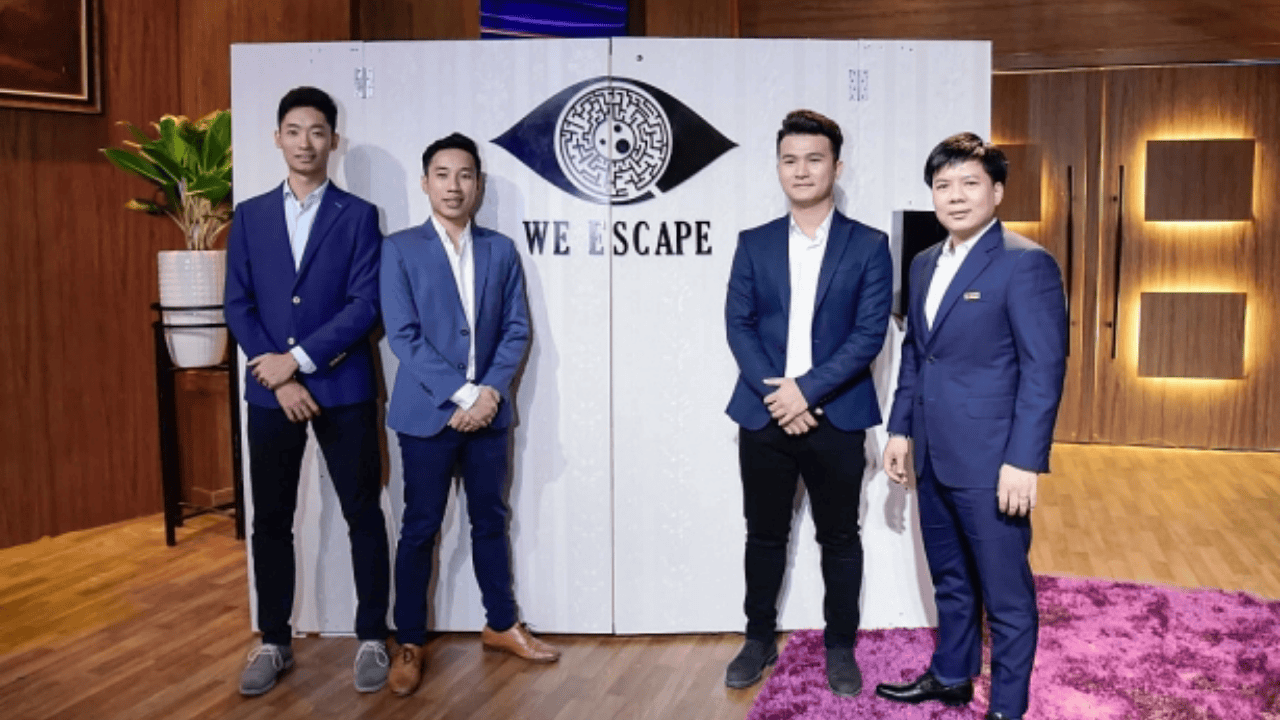 Founders of We Escape Vietnam posing with Shark Tank investor Shark Thuy on the set of Shark Tank Vietnam
